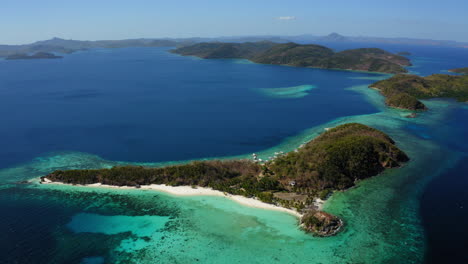 Aerial-view-of-Malcapuya-Beach-island-in-a-sunny-day,-Coron,-Palawan,-Philippines