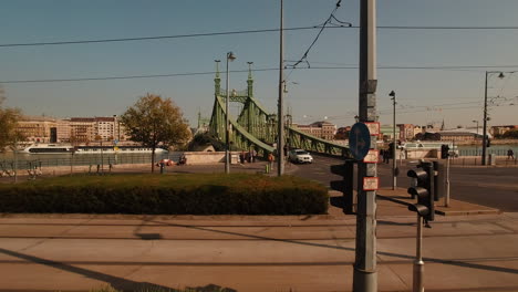 Green-metal-bridge-over-river-Danube-in-city-of-Budapest-Hungary