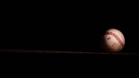 Dirty-Baseball-Drops-Onto-Field-at-Night