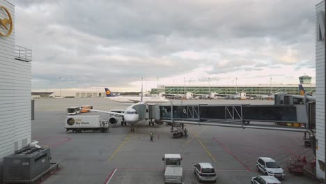 Lufthansa-plane-at-airport-terminal-gate-is-prepared-for-next-flight