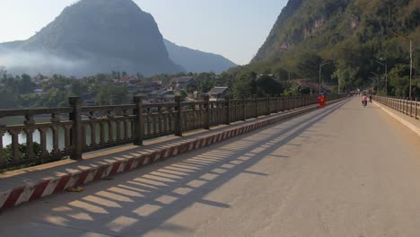 Bridge-crossing-traffic-in-Nong-Khiaw,-Laos