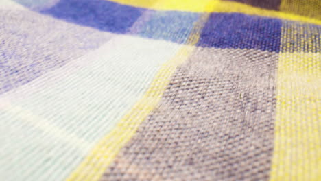 Macro-close-up-of-a-blue-and-yellow,-plaid-shirt