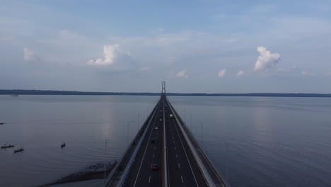 aerial-view-of-the-Suramadu-bridge,-the-longest-bridge-in-Indonesia-connecting-the-islands-of-Java-and-Madura