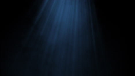 Light-rays-shining-from-above-coming-through-deep-blue-water