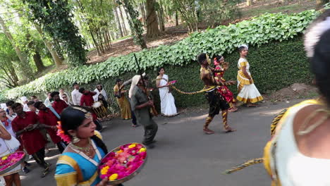 Men-in-tiger-costumes-dance-in-a-local-ceremony-procession-in-Kerala,-India