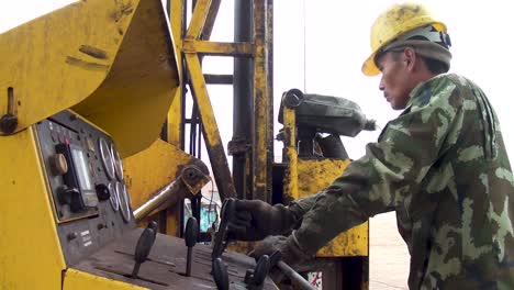 A-Chinese-Worker-Operates-Rock-Mining-Machinery-