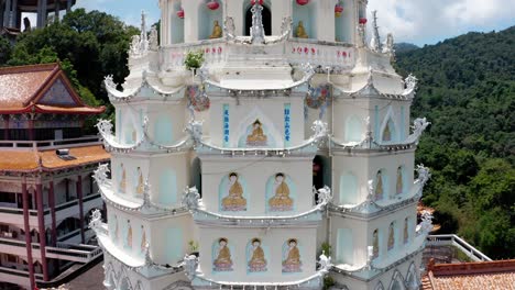 Close-Up-of-Kek-Lok-Si-Buddhist-temple-pagoda-shrine-spire,-Aerial-drone-pedestal-up-and-outshot
