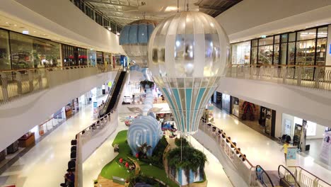 Timelapse-of-people-walking-and-the-style-interior-with-a-balloon-at-Central-Plaza-WestGate,-Bang-Yai-in-Nonthaburi,-Thailand
