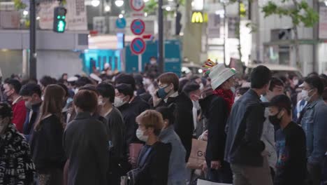 Crowd-Of-People-At-Shibuya-Crossing-In-Tokyo,-Japan-On-Halloween-Night---medium-shot,-slow-motion