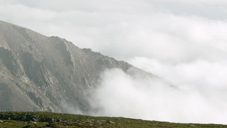 Beautiful-thick-clouds-moving-by-the-mountain-peaks-at-Serra-da-Estrela-in-Portugal---close-up