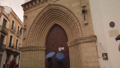 Santa-Catalina-Church-in-Seville,-Spain-on-rainy-day,-SLOWMO-TILT-DOWN
