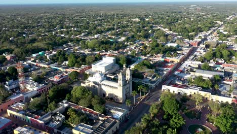 High-aerial-orbit-around-the-left-centered-on-the-Catedral-de-San-Gervasio-in-early-morning-in-Valladolid,-Yucatan,-Mexico