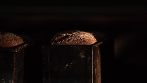 Sourdough-Bread-Baking-Inside-A-Hot-Traditional-Oven---slow-tracking-shot