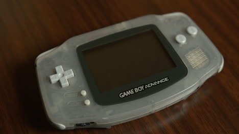 Close-Up-Tilt-of-a-Game-Boy-Advance-on-a-Table