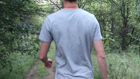 Young-Man-Walking-in-The-Forest,-Summer-time