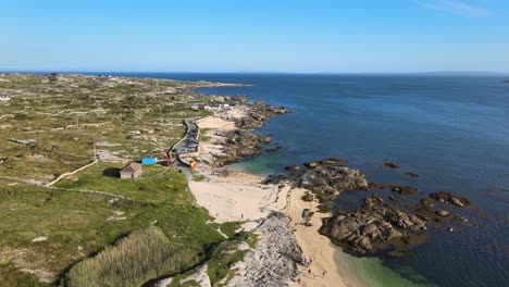 Rocky-Coast-Of-Coral-Strand-Beach-By-The-Calm-Blue-Sea-In-Carraroe,-County-Galway,-Ireland-During-Summer
