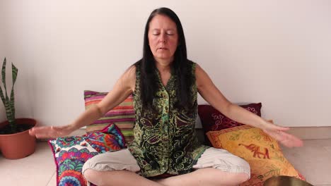 Middle-age-woman-doing-respiratory-exercises,-inhaling-and-exhaling