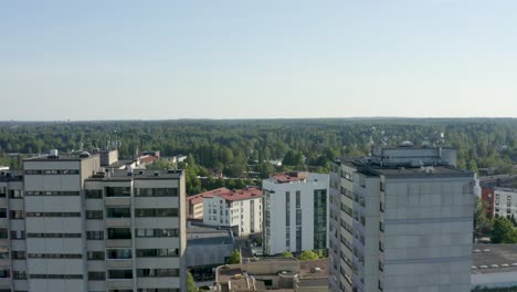 Reverse-fly-through-aerial-view-of-two-large-towers-in-a-Finnish-city-near-Helsinki
