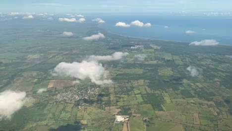 Veracruz-Puerto-city-seen-from-an-aircraf,-landscape-flight-above-the-clouds