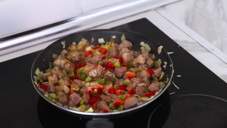 Cooking-pork-and-onions-in-a-hot-pan