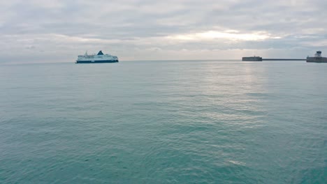 Low-aerial-slider-drone-shot-towards-Dover-to-calais-cross-channel-ferry-leaving-dover-harbour