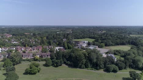 Left-to-right-aerial-shot-above-park-in-Solihull,-Birmingham,-UK
