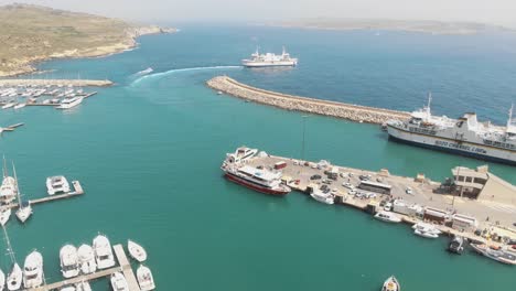 Aerial-Clockwise-Shot-Of-Mgarr-Harbour-In-Gozo-Malta