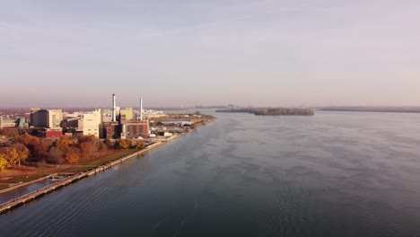 Flying-Towards-Shut-Down-Power-Plant-Station-Of-Wyandotte-Michigan-City-At-Detroit-River-During-Fall-Season