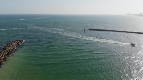 Yacht-arriving-at-gulf-shores-Alabama-USA-ocean-aerial