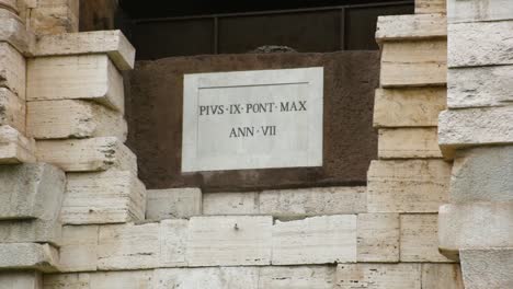 Sign-above-the-entrance-gate-in-the-Colosseum,-Rome,-Italy