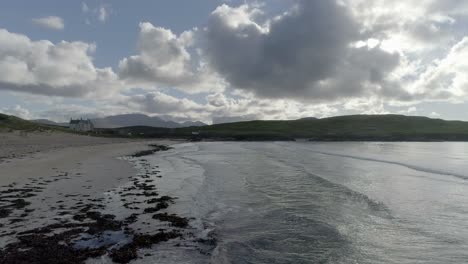 Aerial-tracking-low-along-the-tide-on-Balnakeil-beach