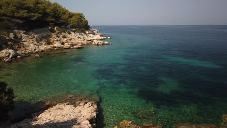 Panning-view-of-clear-waters-and-amazing-blue-waters-of-Svitnja-beach-on-the-island-of-Vis-in-Croatia
