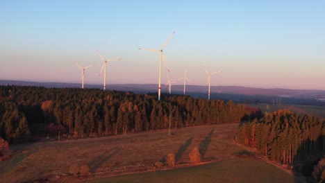 Aerial-View,-Wind-Park-and-Turbines-in-Countryside-Landscape-on-Sunset-Sunlight