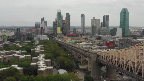 Drone-aerial-slide-back-along-the-Queensboro-Bridge-in-NYC-moving-towards-Queens