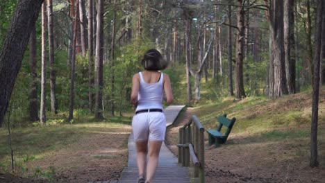 Girl-running-away-in-the-forest