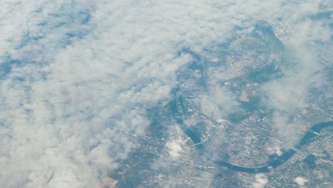 Aerial-shot-of-city-and-meandering-river