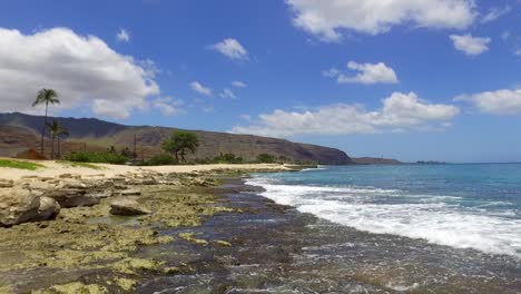 Drone-flying-low-over-ocean-in-Hawaii