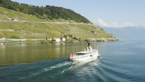 Aerial-shot-passing-behind-CGN-steam-Belle-Epoque-ship-on-Lake-Léman-in-front-of-Lavaux