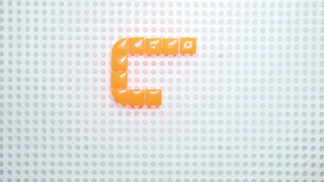 stop-motion-of-the-letter-S-creating-one-pixel-at-the-time,-made-with-children-toys