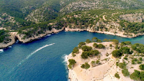 Drone-footage-of-boat-in-calanque-next-to-Cassis,-south-of-France