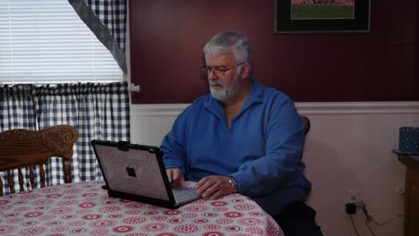 Senior-Citizen-Happy-Using-a-Computer-and-Technology-to-do-Daily-Activities