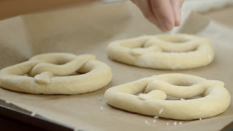 Slowmotion-shot,-salt-being-put-on-frozen-pretzels