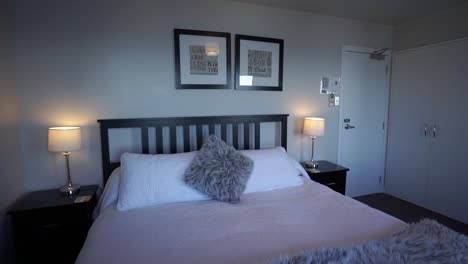 SLOWMO---Luxury-modern-boutiqe-hotel-room-double-queensize-bed-with-lamps,-ocean-sea-view