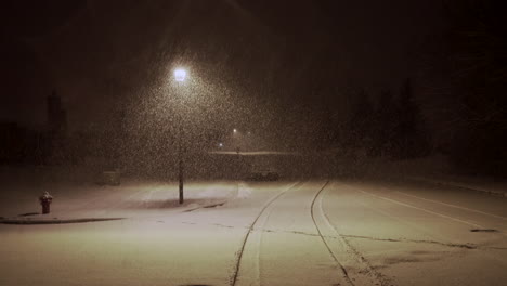 Heavy-snow-falling-quiet-neighborhood-street