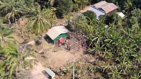 Aerial-clip-of-unfinished-house-under-construction-in-Battambang-Cambodia-during-a-hot-dusty-summer-day