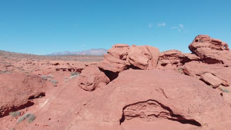 Drone-going-up-over-red-rock