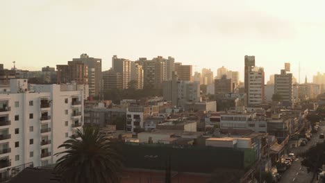 Sunset-over-the-skyline-of-Lima-city-with-modern-architecture,-Peru