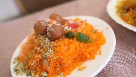 Close-up-of-Indo-and-Islamic-dessert-dish-Metha-Zarda-or-Sweet-Rice-or-Zarda-or-Shkrana-with-all-dry-fruit-including-coconut-and-sugar