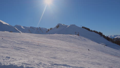 ski-area-in-the-Swiss-alps-with-people-and-chairlifts-in-the-winter-ski-area-of-Beckenried