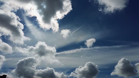 Dramatic-sky-background-with-white-clouds-and-planes